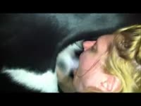 Blonde giving blowjob to a dog's hard dick